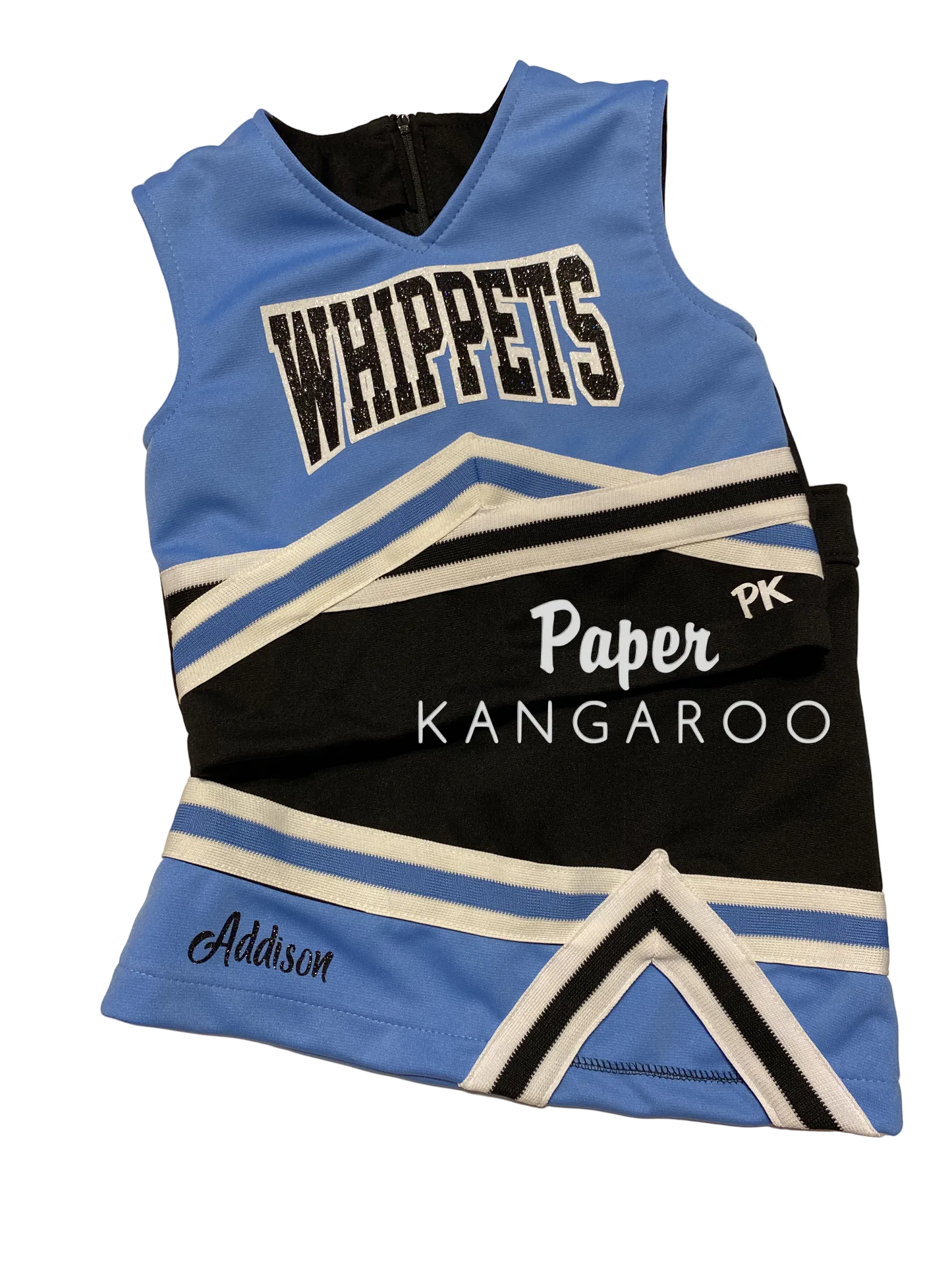 A custom cheerleader-style sleeveless jersey laid flat on a light beige surface. The jersey is light blue and black with white stripes and lettering.