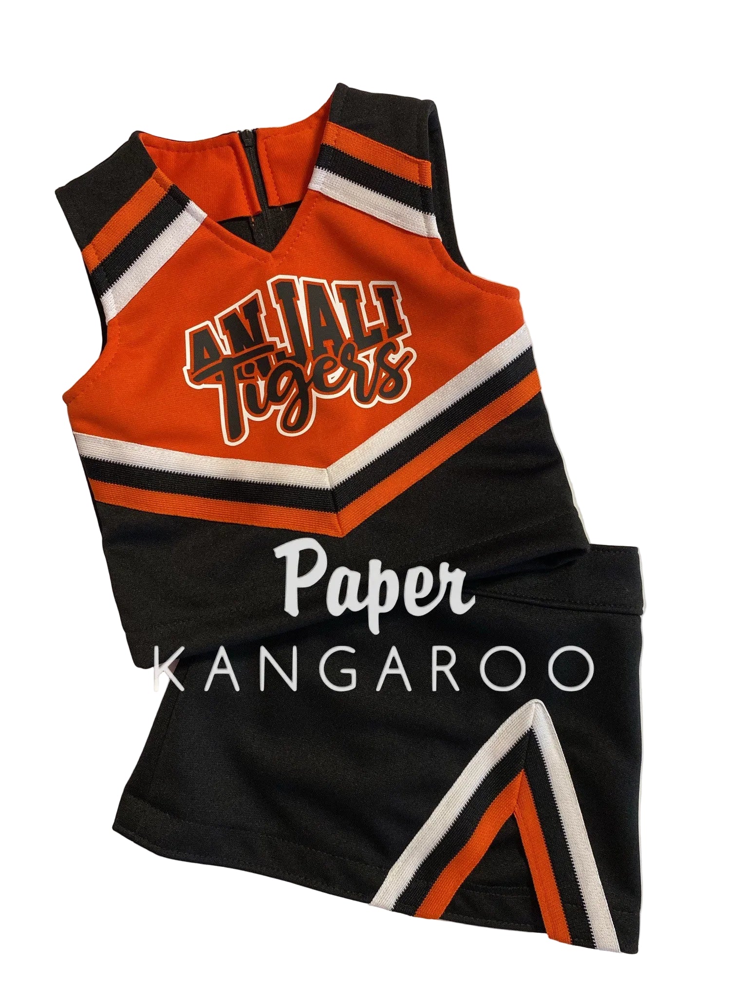 A cheerleader-style sleeveless top and matching shorts set laid flat on a light background. The color scheme is predominantly black and bright orange with white stripes and lettering.