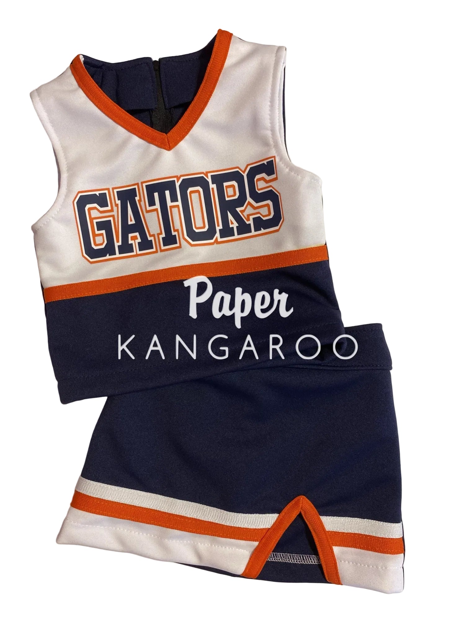 A children's cheerleader-style uniform set laid flat on a light background, featuring a white sleeveless top with navy and orange trim, large 'GATORS' lettering, and a matching navy skirt with white and orange striped hem.