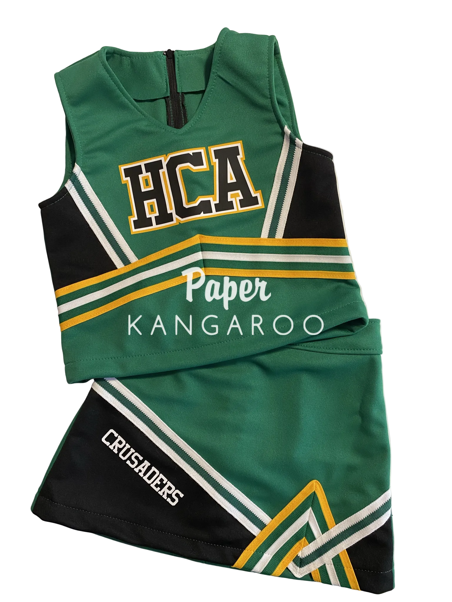 A green and black cheerleader uniform set with white, yellow, and green stripes, featuring 'HCA' on the top and 'CRUSADERS' on the skirt, laid flat on a white surface.