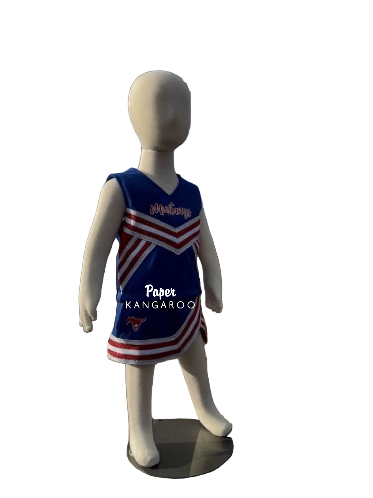 A children's cheerleader-style sleeveless dress displayed on a white mannequin outdoors. The dress is royal blue with red and white diagonal stripes and the word 'Mustangs' across the chest.