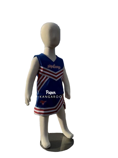A children's cheerleader-style sleeveless dress displayed on a white mannequin outdoors. The dress is royal blue with red and white diagonal stripes and the word 'Mustangs' across the chest.
