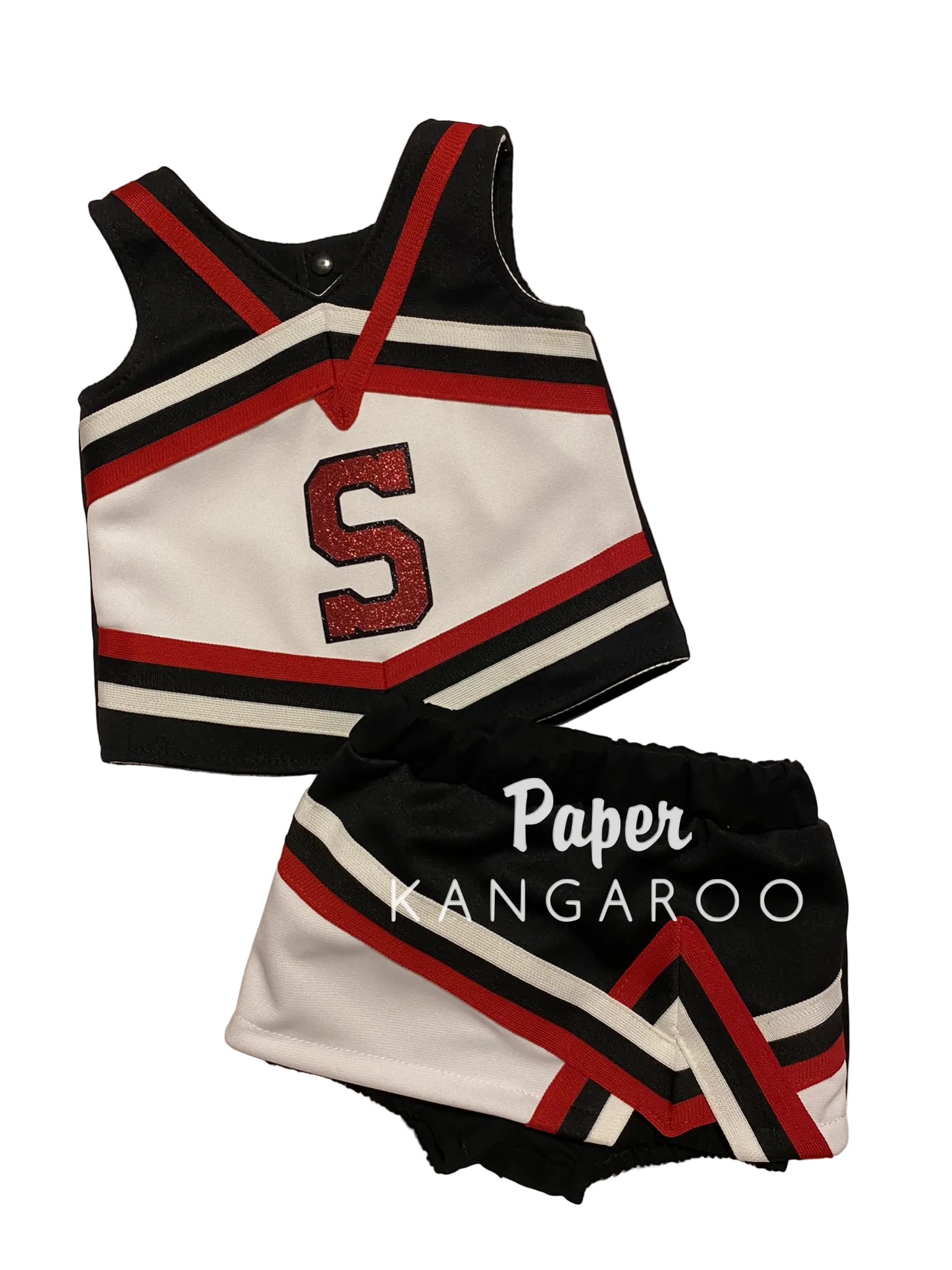 A two-piece cheerleader outfit set consisting of a sleeveless top and matching shorts, featuring a black, white, and red color scheme with a glittery red letter 'S' on the top. The shorts have a black and white chevron pattern with red accents.